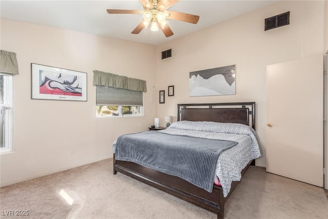 carpeted bedroom featuring ceiling fan and lofted ceiling