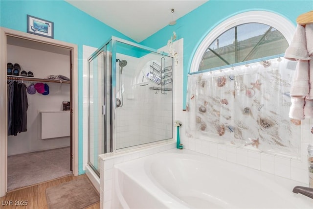 bathroom featuring separate shower and tub and hardwood / wood-style floors