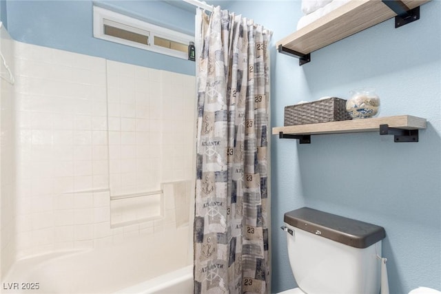 bathroom featuring shower / bathtub combination with curtain and toilet