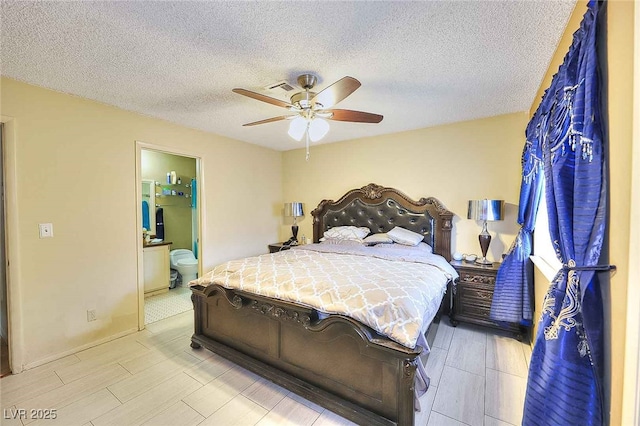 bedroom with connected bathroom, a textured ceiling, and ceiling fan