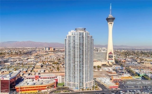 property's view of city with a mountain view