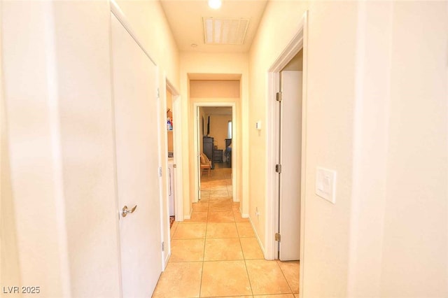 corridor featuring light tile patterned flooring