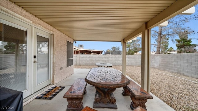 view of patio with a fenced backyard and a grill