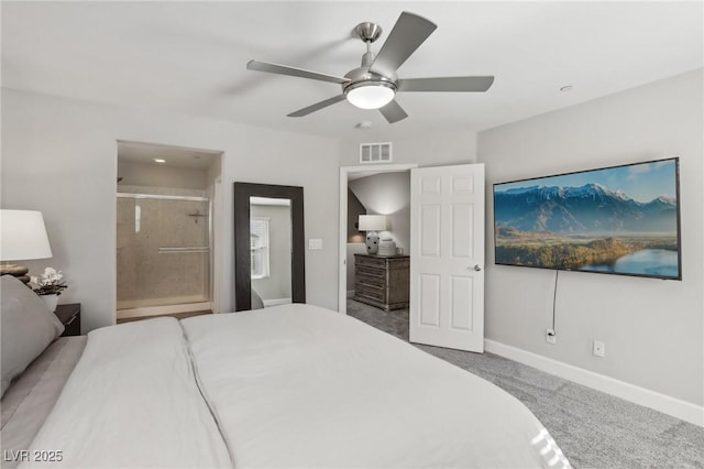 carpeted bedroom with a ceiling fan, ensuite bath, baseboards, and visible vents