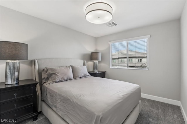 bedroom with visible vents, baseboards, and dark carpet