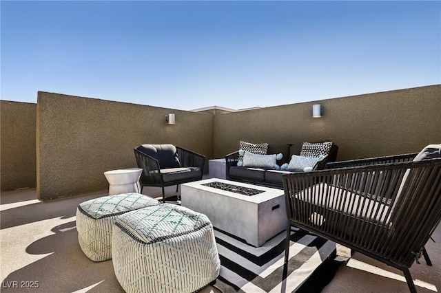 view of patio with fence and an outdoor fire pit