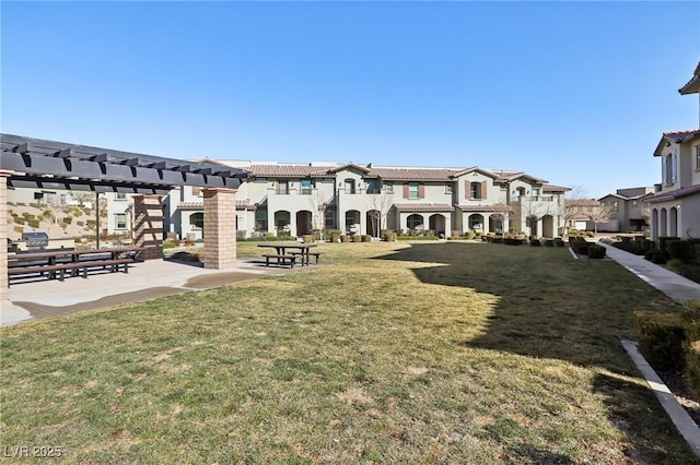 surrounding community with a pergola, a lawn, a residential view, and a patio area