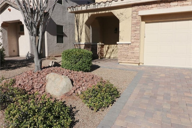 entrance to property featuring a garage