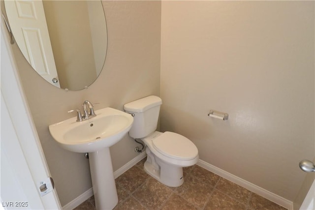 bathroom featuring toilet