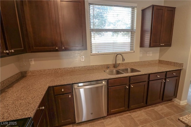 kitchen with sink, stove, dark brown cabinetry, light stone countertops, and stainless steel dishwasher