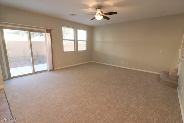 unfurnished room featuring ceiling fan and carpet flooring