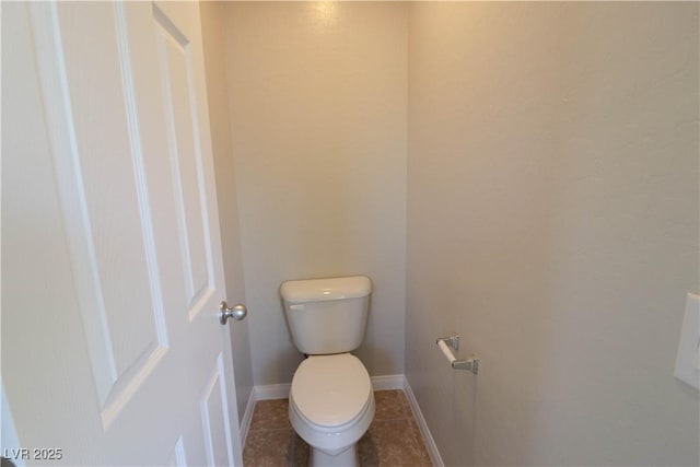 bathroom with tile patterned floors and toilet