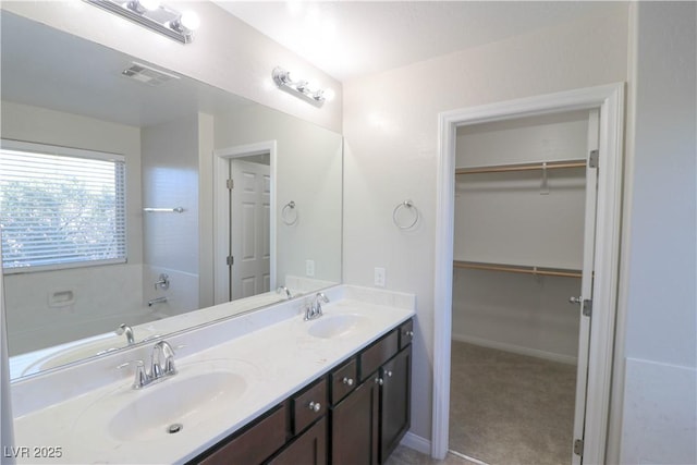 bathroom with vanity and a bathing tub