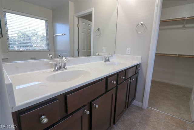 bathroom with tile patterned floors and vanity