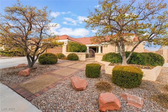 mediterranean / spanish-style house with a garage