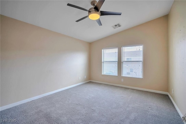 carpeted empty room with lofted ceiling and ceiling fan