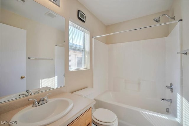 full bathroom featuring shower / tub combination, vanity, and toilet