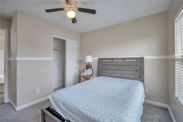 carpeted bedroom featuring a closet and ceiling fan