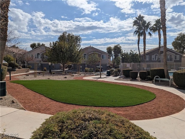 view of community featuring a yard