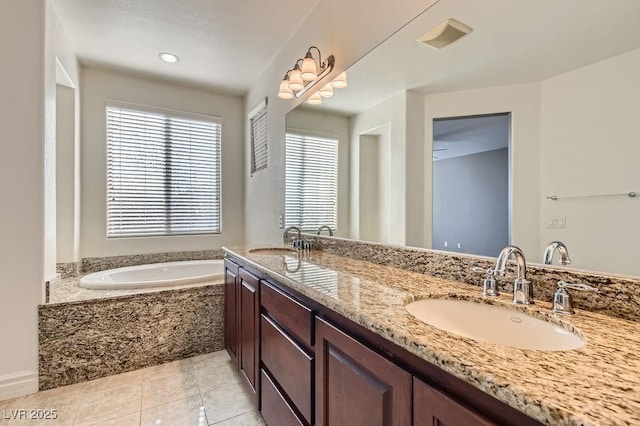 bathroom with double vanity, a sink, a bath, and tile patterned floors