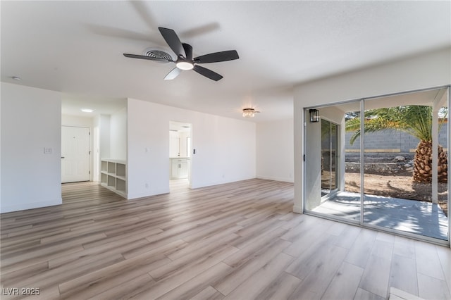 unfurnished living room featuring ceiling fan and light hardwood / wood-style floors