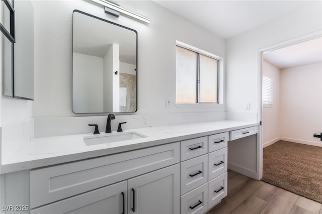 bathroom with vanity and hardwood / wood-style floors