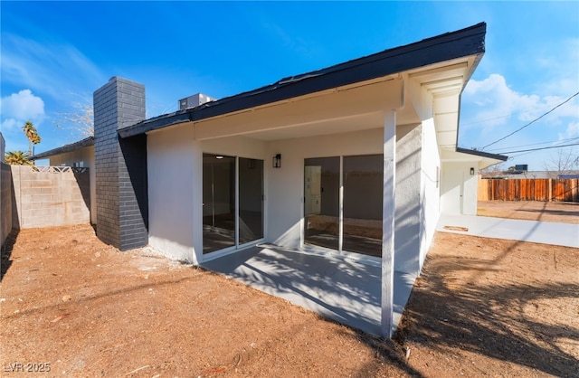 rear view of property with a patio