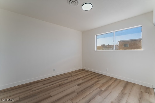 empty room featuring light hardwood / wood-style floors