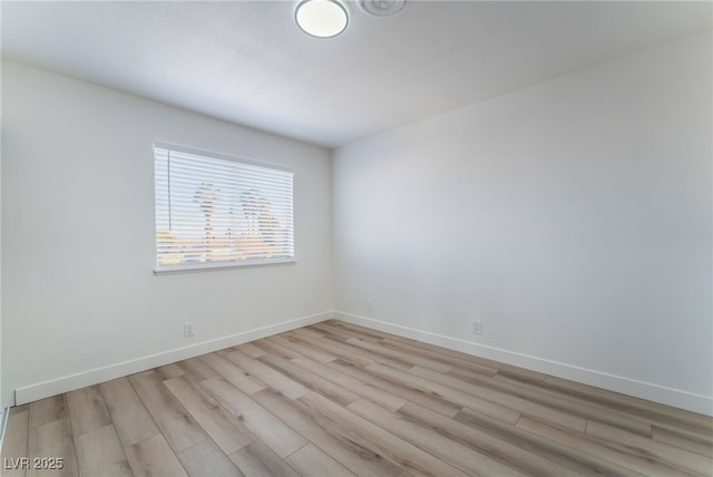 unfurnished room with light hardwood / wood-style floors