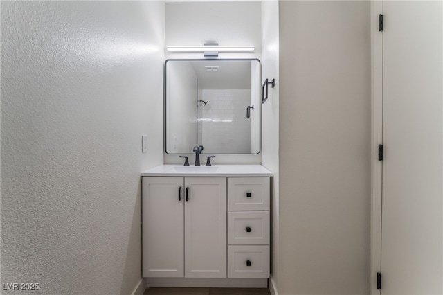 bathroom featuring vanity and walk in shower