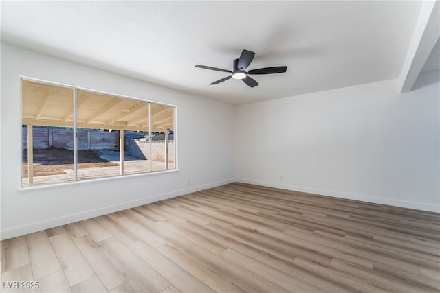 unfurnished room featuring hardwood / wood-style floors and ceiling fan