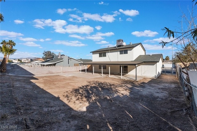 rear view of house featuring a patio and central air condition unit