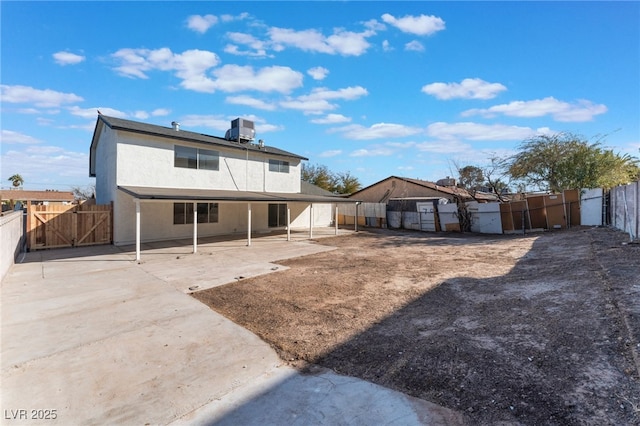 back of house featuring a patio and central air condition unit