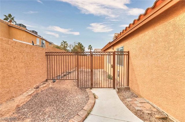 view of yard featuring a gate and a fenced backyard