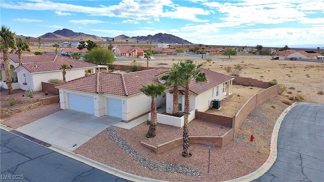 birds eye view of property with a mountain view