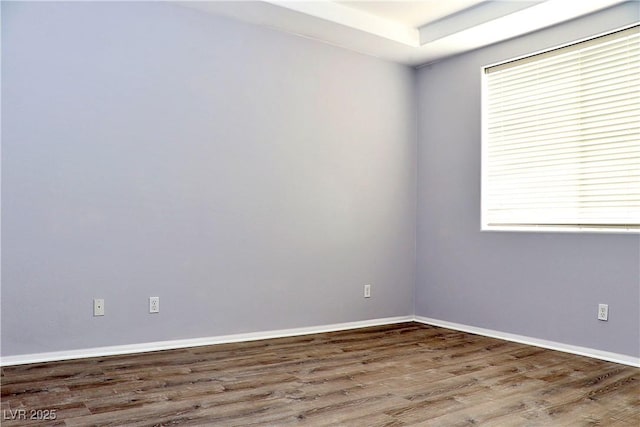 spare room with hardwood / wood-style flooring