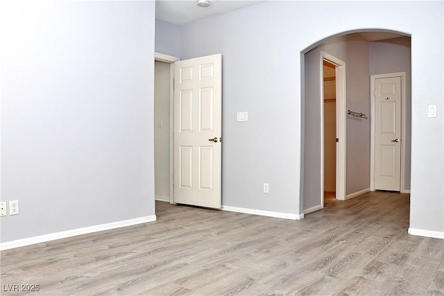 spare room with light wood-type flooring