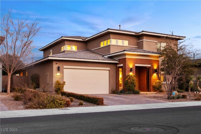 prairie-style home featuring a garage