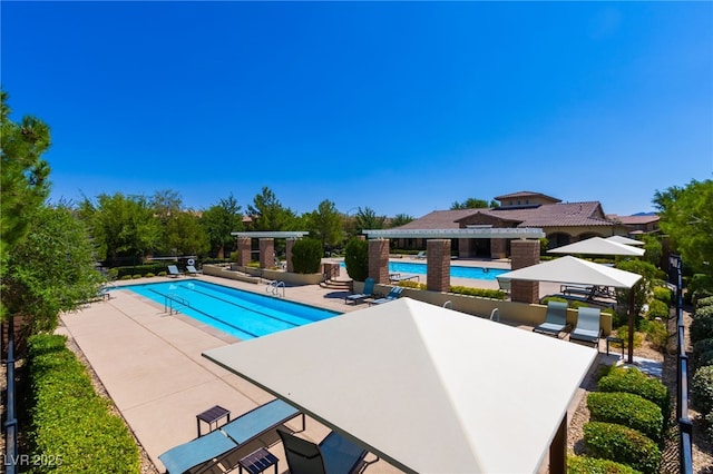 view of swimming pool with a gazebo and a patio area