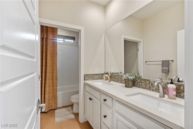 full bathroom featuring tasteful backsplash, vanity, shower / tub combo with curtain, and toilet