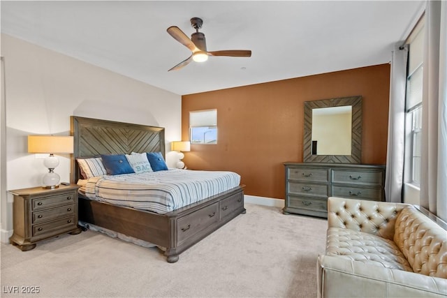 bedroom featuring light carpet and ceiling fan