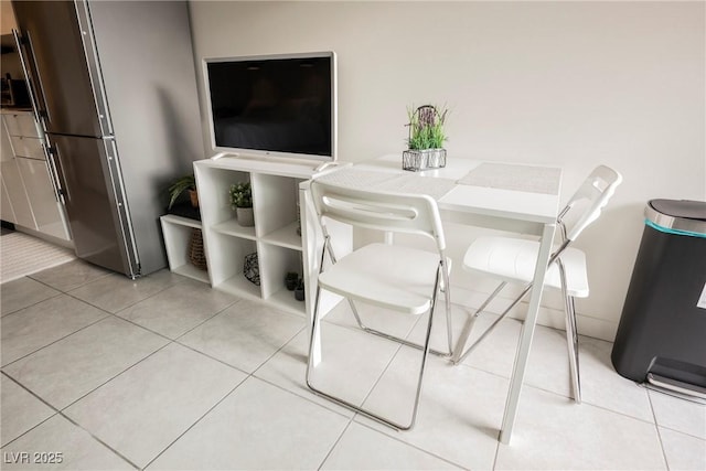 dining space with light tile patterned floors