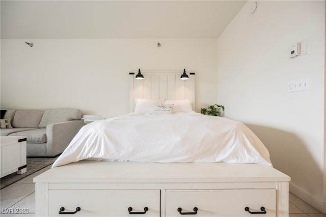 bedroom with light tile patterned floors