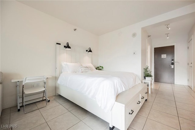 bedroom featuring light tile patterned flooring