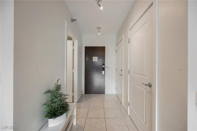 corridor with light tile patterned flooring