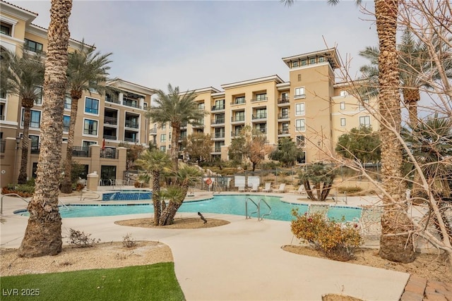 view of swimming pool featuring a patio area