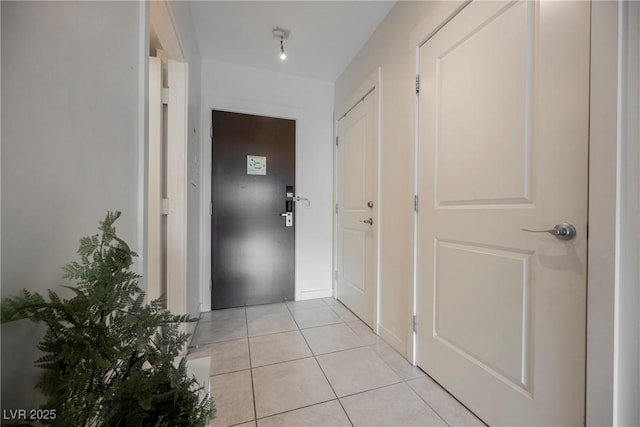 hallway featuring light tile patterned floors