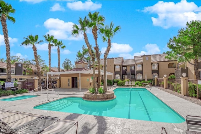 view of swimming pool featuring a patio area