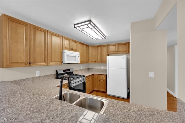 kitchen featuring sink and white appliances