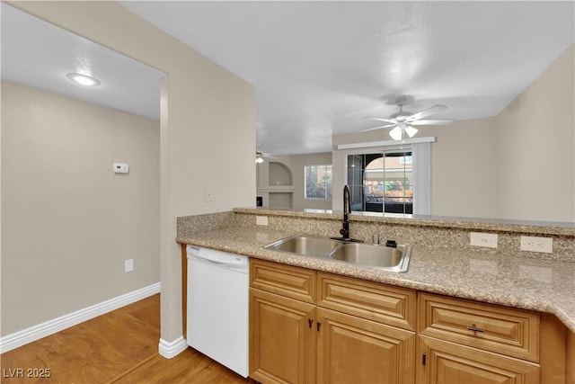 kitchen with ceiling fan, sink, white dishwasher, and light wood-type flooring